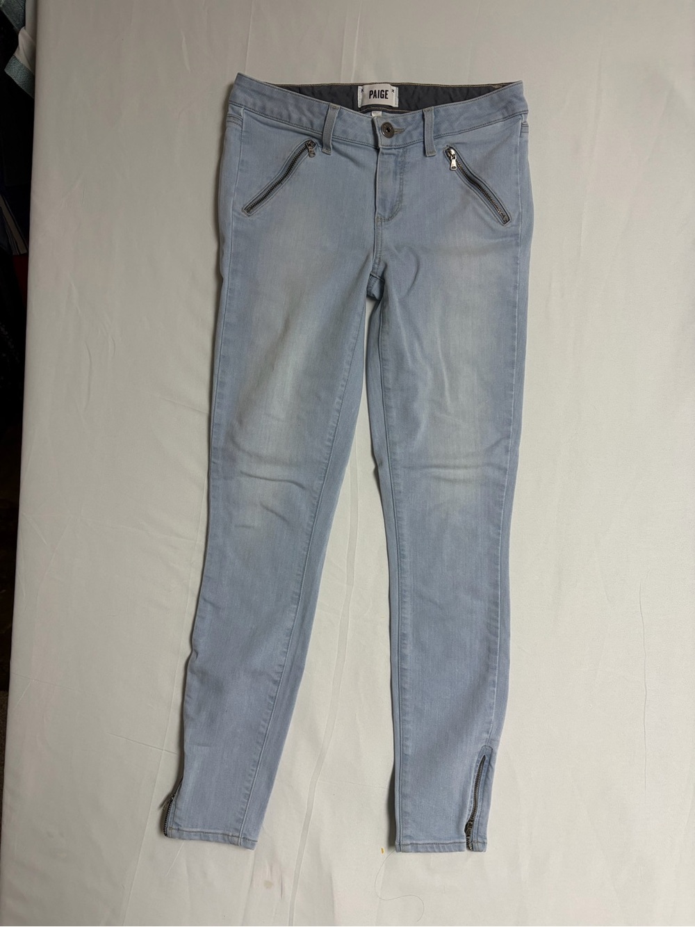 PAIGE Light Wash Skinny Jeans with Zip Pockets